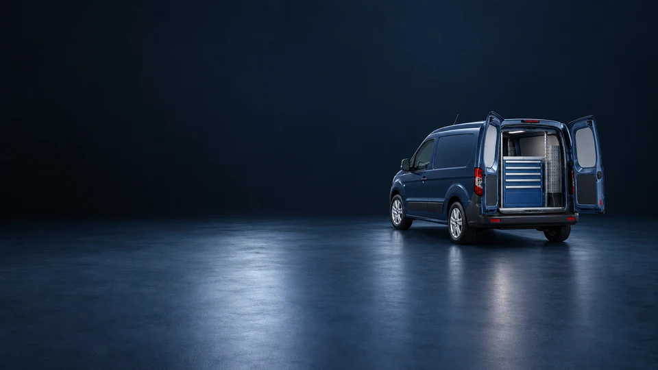 A navy mobile-mechanic van with open rear doors showing a compact tool cabinet. - Automotive Services Meta ads research index