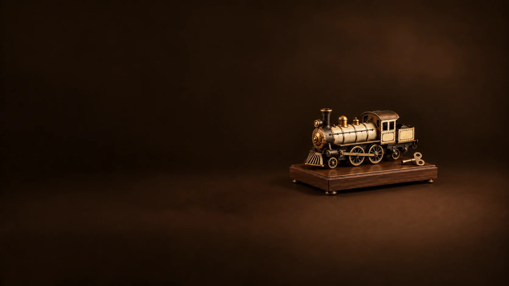 A bronze-and-cream model locomotive with a winding key on a small walnut display platform. - Vintage Toys & Models Meta ads research by Madgicx Labs