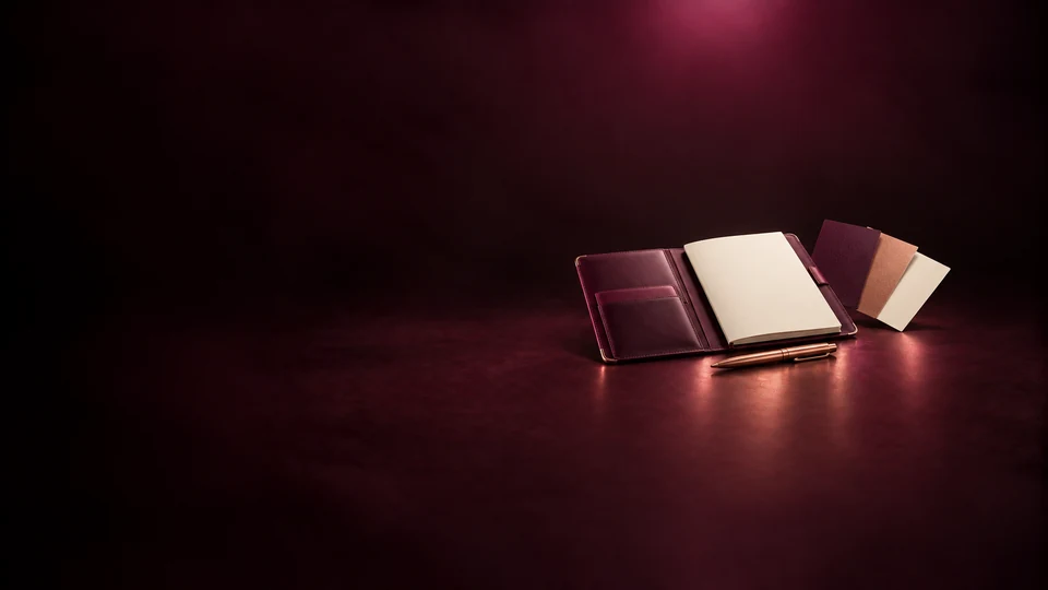 An open leather portfolio with blank pages and material swatches. - Content Creators & Influencers Meta ads research index