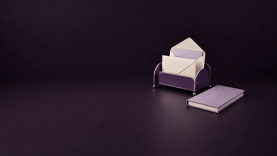 A violet mail rack holding blank envelopes beside a lavender notebook. - Digital Marketing & Advertising Platforms Meta ads research index