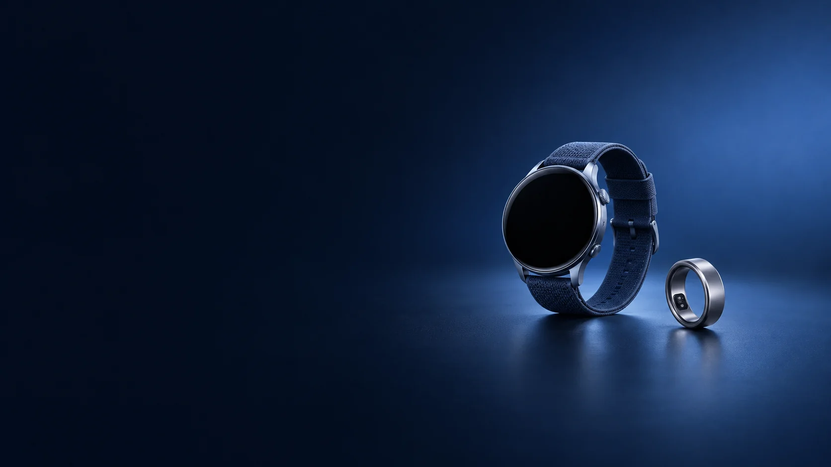 Round smart watch with a blue fabric band beside a titanium ring. - Wearable Tech Devices Meta ads research by Madgicx Labs