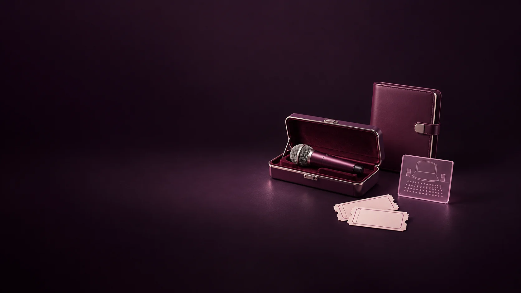 A microphone in its fitted case beside a blank booking folio, miniature stage-plan tile and two unmarked tickets. - Entertainment Booking Agencies Meta ads research by Madgicx Labs