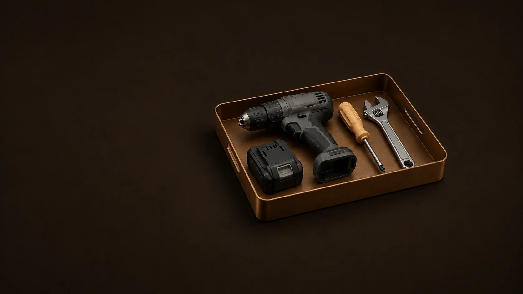 An inactive cordless drill, detached battery, screwdriver and wrench in a low tool tray. - Power Hand Tools Meta ads research by Madgicx Labs