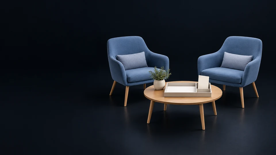 Two empty blue consultation chairs facing a low table with a blank intake tray and separate envelope. - Legal Services Meta ads research index
