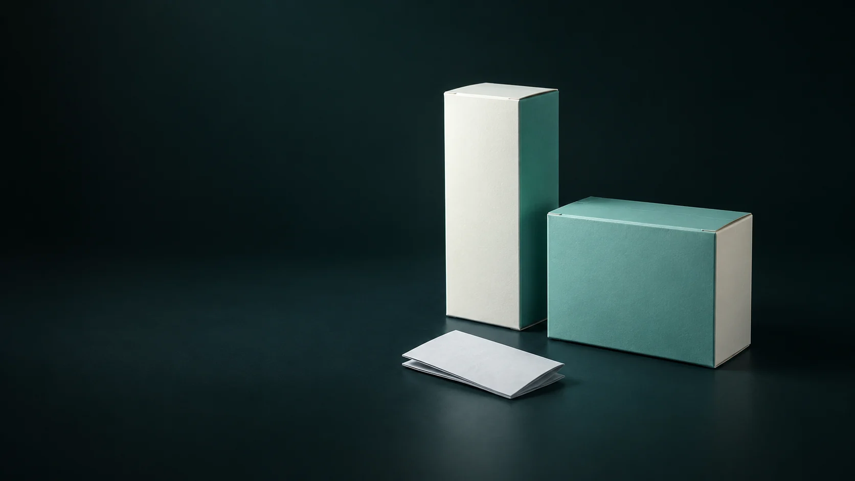 Two blank cartons of different proportions beside a folded ivory leaflet. - Over The Counter Medications Meta ads research by Madgicx Labs