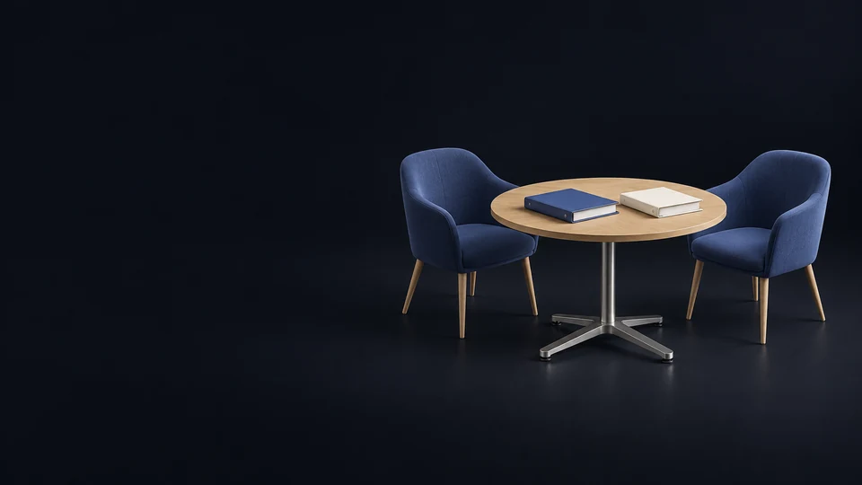 Two empty indigo chairs around a complete round oak seminar table with separate blank indigo and ivory binders. - Political & Civic Organizations Meta ads research index