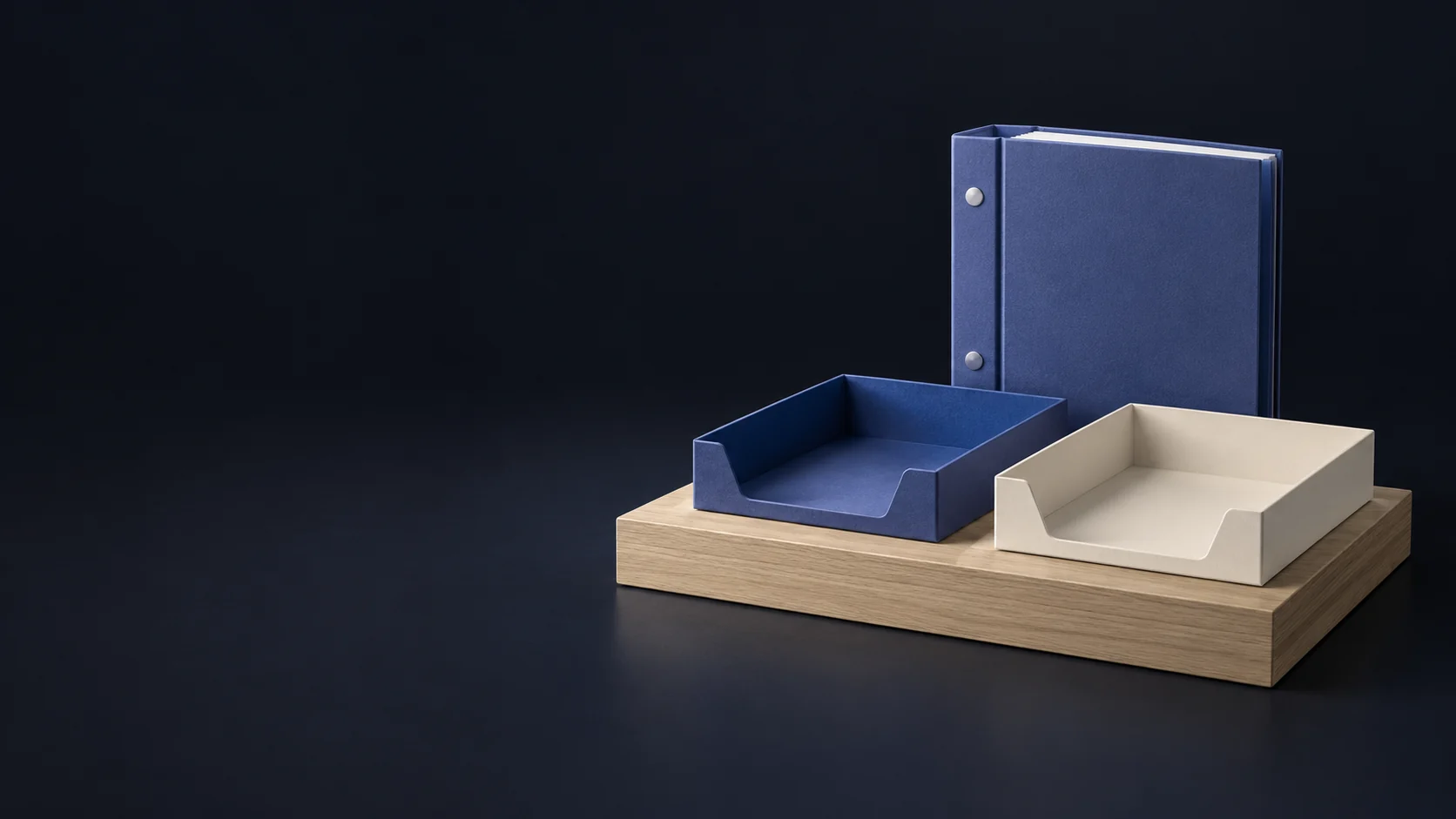 Two empty indigo and ivory document trays on a complete low oak counter with a thick unmarked indigo binder behind. - Political Action Committees Meta ads research by Madgicx Labs