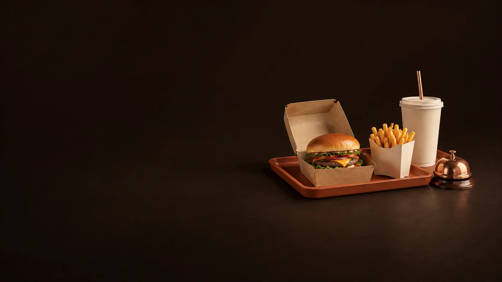 Burger, fries and takeaway drink on a terracotta tray beside a copper pickup bell. - Fast Food Quick Service Meta ads research by Madgicx Labs
