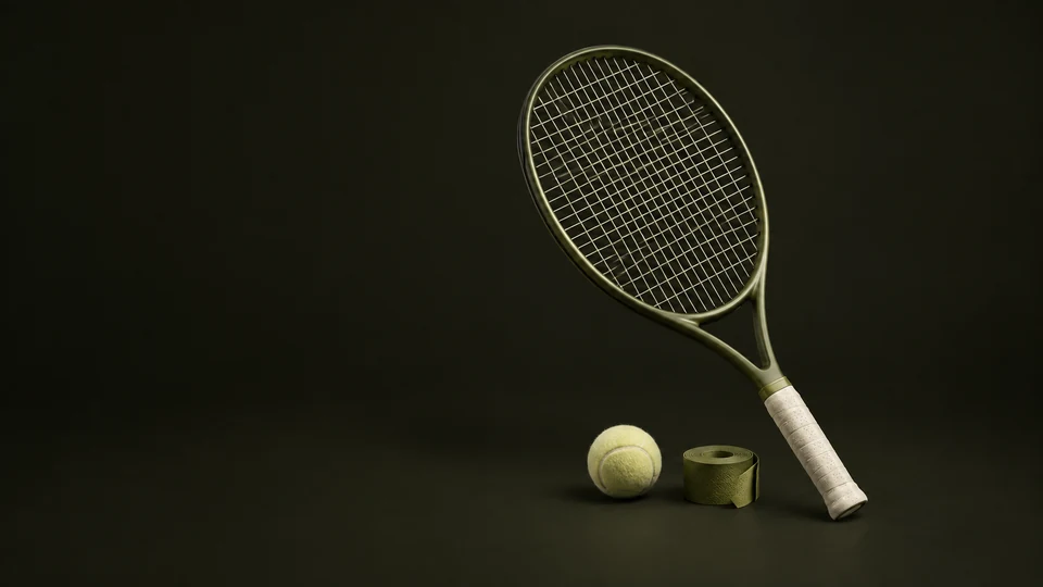 An olive tennis racket with cream grip stands beside a pale ball and an overgrip roll. - Sports & Outdoor Equipment Meta ads research index