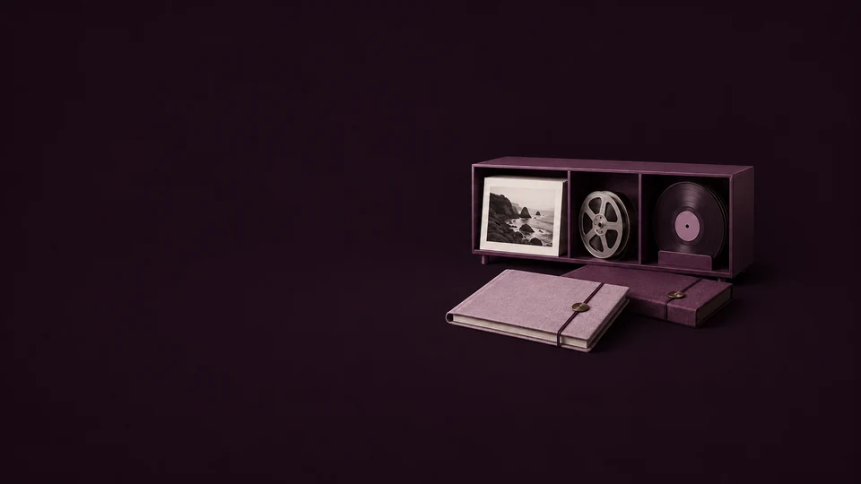 A plum media cabinet holding a coastal photograph, film spool and sound disc, with two linen project folios. - Stock Media & Content Platforms Meta ads research index
